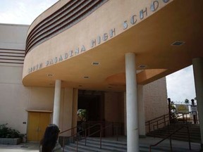 A person walks into South Pasadena High School in South Pasadena, California August 19, 2014.  REUTERS/Lucy Nicholson