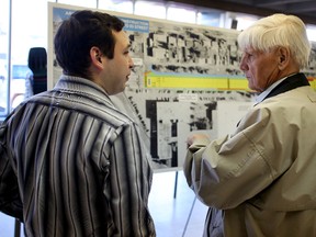 City of Edmonton senior engineer, Matthew Ivany, left, and 52-year Ottewell resident, William Opper, review construction plans to rebuild 90 Avenue, from 83 Street to 75 Street, at Vimy Ridge Academy, 8205 90 Avenue, on Wednesday April 15, 2015 in Edmonton, AB. Trevor Robb/Edmonton Sun/Postmedia Network