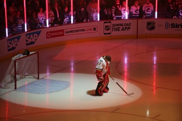 Calgary Flames' goalie Jonas Hiller during the singing of the national anthem against the Vancouver Canucks of Game 1 in a first-round NHL playoffs series at Rogers Arena on April 15, 2015. (Carmine Marinelli/Postmedia Network)