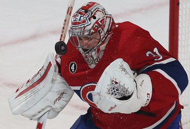 Montreal Canadians goalie Carey Price makes a save during first period action against the Ottawa Senators in Game 1 of the first round of the NHL playoffs at the Bell Centre on April 15, 2015. (Tony Caldwell/Postmedia Network)