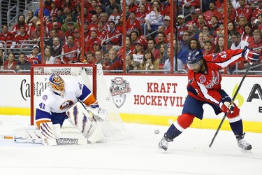 New York Islanders goalie Jaroslav Halak makes a save on Washington Capitals right winger Joel Ward in the second period in Game 1 of the first round of the the 2015 NHL playoffs at Verizon Center on April 15, 2015. (Geoff Burke/USA TODAY Sports)