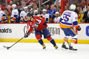 Washington Capitals left winger Alex Ovechkin skates with the puck past New York Islanders defenseman Johnny Boychuk in the second period in Game 1 of the first round of the the 2015 NHL playoffs at Verizon Center on April 15, 2015. (Geoff Burke/USA TODAY Sports)