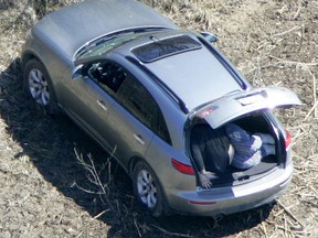The body of Paul ?Big Paulie? Sinopoli in the trunk of a car at the site of an eight-person massacre in Shedden. (Free Press file photo)