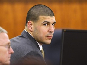 Former NFL player Aaron Hernandez and defence attorney Charles Rankin  wait in the courtroom during the jury deliberation in his murder trial at the Bristol County Superior Court in Fall River, Massachusetts, April 10, 2015. (REUTERS)