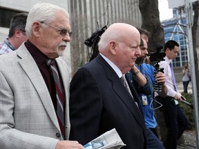 Senator Mike Duffy leaves the Ottawa Courthouse on the Apr. 13, 2015 after day five of testimony in the trial relating to his Senate expense claims. 
Andrew Meade/ Ottawa Sun/Postmedia Network