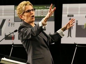 Premier Kathleen Wynne explains the changes from the Premier's Advisory Council on Government Assets on Thursday, April 16, 2015. (MICHAEL PEAKE/Toronto Sun)
