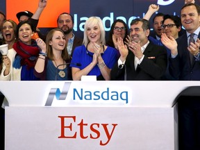 Etsy CEO Chad Dickerson (2nd R) and CFO Kristina Salen (C) stand with Etsy employees and Nasdaq executive vice president Bruce Aust (R) as they celebrate Etsy's initial public offering (IPO) at the Nasdaq market site in New York April 16, 2015.   REUTERS/Mike Segar