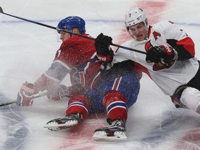 Ottawa Senators Kyle Turris hits hits Montreal Canadiens Lars Eller during first period action at the Bell Centre in Montreal Wednesday April 15,  2015. The Senators and Canadiens were playing game one of the Stanley Cup Playoffs.  Tony Caldwell/Postmedia Network