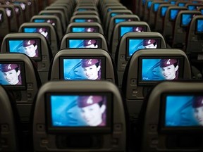 Seats and screens are seen in the economy class cabin of Qatar Airways new Boeing 787 Dreamliner are seen after it arrived on it's inaugural flight to Heathrow Airport. REUTERS/Andrew Winning