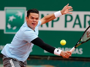 Milos Raonic returns the ball to Tommy Robredo during their match at the Monte Carlo Masters in Monaco April 16, 2015. (REUTERS/Eric Gaillard)
