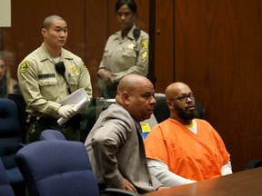 Former rap mogul Marion "Suge'' Knight, (R), appears in court with his Lawyer Matthew P Fletcher (center), in Los Angeles April 8, 2015, REUTERS/Irfan Khan/Pool