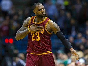 Cleveland Cavaliers forward LeBron James reacts after making a basket during the fourth quarter against the Milwaukee Bucks at BMO Harris Bradley Center on April 8, 2015. (Jeff Hanisch/USA TODAY Sports)