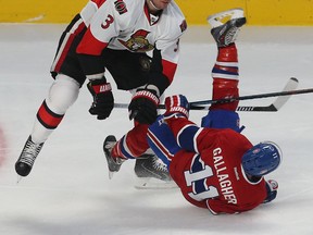 Ottawa Senators Mark Methot hits Montreal Canadiens Brendan Gallagher during first period action at the Bell Centre in Montreal Wednesday April 15,  2015. The Senators and Canadiens were playing game one of the Stanley Cup Playoffs. (Tony Caldwell/Postmedia Network)
