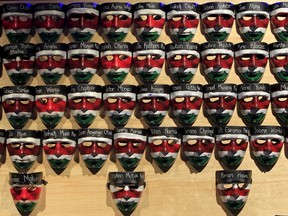 Face masks with names of the Garissa university students who were killed during an attack by gunmen are placed on a wooden board, during a memorial concert at the "Freedom Corner" in Kenya's capital Nairobi April 14, 2015. Kenya gave the United Nations three months to remove Dadaab camp, housing 350,000 registered Somali refugees, as part of its response to the killing of 148 people in nearby Garissa by a Somali Islamist group. REUTERS/Noor Khamis