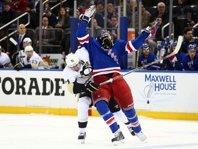 Pittsburgh Penguins center Evgeni Malkin hits New York Rangers left wing Rick Nash during the first period of game one of the first round of the the 2015 NHL playoffs at Madison Square Garden on April 16, 2015. (Brad Penner/USA TODAY Sports)