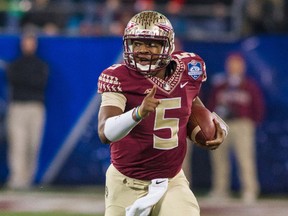 Florida State QB Jameis Winston runs the ball during second quarter action against Georgia Tech in Charlotte, N.C., on Dec. 6, 2014. (Jeremy Brevard/USA TODAY Sports/Files)
