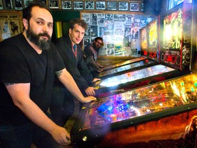 Tony Lima, owner of Call the Office, and Michael Todd of Speed City Records are setting up pinball machines at the iconic bar at York and Clarence steets in London.
Mike Hensen/The London Free Press/Postmedia Network