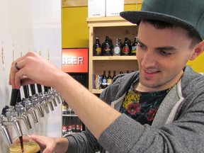 Bartender Mike Cole pours a beer on Friday April 17, 2015 at the Refined Fool brewery in Sarnia, Ont. Owners of the Sarnia nano-brewery say Ontario's move to reform beer sales is a good first step. Paul Morden/Sarnia Observer/Postmedia Network