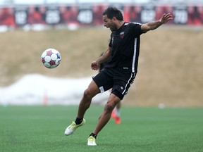 Fury FC forward Paulo Jr. leaps for a ball during training at TD Place on Friday. The Brazilian is expected to return to action Saturday after missing one game with an injury. (Chris Hofley/Ottawa Sun)
