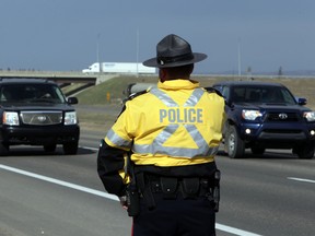 Edmonton Police Service Sgt. Steve Levesque prepares to pull over speeders, distracted drivers and seat belt infractions on Yellowhead Trail and Hywy 60 near Edmonton, Alberta on Thursday April 16, 2015. EPS, RCMP, and Commercial Vehicle Enforcement units got together for this joint operation. Perry Mah/Edmonton Sun/Postmedia Network