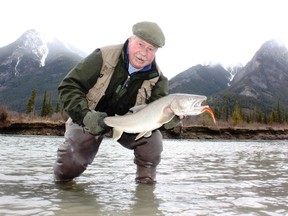 Neil with a fine Athabasca River "dolly." (Neil Waugh photo)