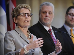 Ontario Premier Kathleen Wynne and Quebec Premier Philippe Couillard announced last year they will have a common market for cap and trade of greenhouse gas emissions. (Postmedia Network file photo)