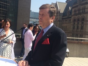 Toronto Mayor John Tory speaks outside City Hall on April 17, 2015. (Don Peat/Toronto Sun)