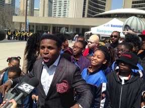 Toronto Argonauts legend Michael "Pinball" Clemons in Nathan Phillips Square on April 17, 2015 to kick-off the 20-Minute Makeover as part of the Clean Toronto Together campaign. (Don Peat/Toronto Sun)