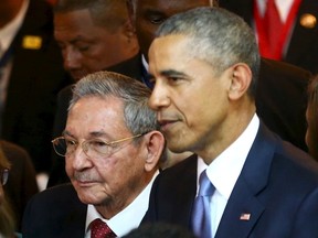 Cuba's President Raul Castro (L) stands with his U.S. counterpart Barack Obama before the inauguration of the VII Summit of the Americas in Panama City April 10, 2015.  REUTERS/Peru Presidency/Handout via Reuters