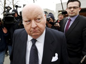 Suspended senator Mike Duffy leaves the Ontario Court of Justice in Ottawa, April 8, 2015. (BLAIR GABLE/Reuters)