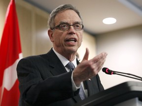 Finance Minister Joe Oliver talks to the media after meeting with private sector economists in Ottawa, April 9, 2015. (REUTERS/Patrick Doyle)