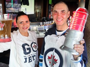 Nicole Balliet (l) and Mike Aston of the Pony Corral in Winnipeg, Man. are prepared for the Jets' first playoff game Thursday April 16, 2015.