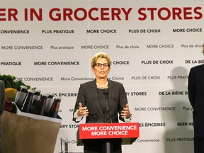 Ontario Premier Kathleen Wynne explains the changes on new beer rules and the selling of part of the hydro system on April 16, 2015. (Michael Peake/Postmedia Network)