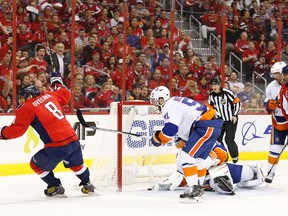 Washington Capitals left winger Alex Ovechkin scores a goal on New York Islanders goalie Jaroslav Halak in Game 2 of the first round of the 2015 NHL playoffs at Verizon Center on April 17, 2015. (Geoff Burke/USA TODAY Sports)