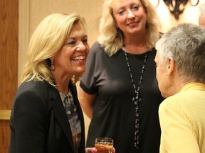 PC leadership hopeful Christine Elliott meets with Pat and Mike Preudhomme at a campaign stop in Sarnia at the Holiday Inn Friday. Looking on is Marilyn Gladu, the Sarnia-Lambton Conservative Party nominee for the upcoming federal election.