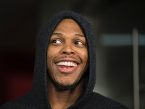 Kyle Lowry smiles as he waits to talk to the media on Friday at the ACC. (CRAIG ROBERTSON, Toronto Sun)