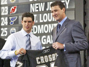 Sidney Crosby accepts his Pittsburgh Penguins jersey from Mario Lemieux after being made the No. 1 overall pick in the 2005 NHL entry draft. The Penguins won the lottery that year and, when that happened, “our world turned upside down,” said team vice-president Tom McMillan. (Toronto Sun files)