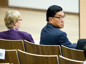 Western University president Amit Chakma looks over his shoulder as university senators debate a motion of non-confidence in the embattled school leader, which was voted down at the Ivey School of Business in London, Ont. on Friday April 17, 2015.  
Craig Glover/The London Free Press/Postmedia Network
