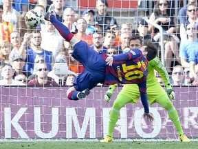 Barcelona forward Lionel Messi tries to score during Saturday’s Spanish league against Valencia at the Camp Nou stadium in Barcelona. (AFP PHOTO/JOSEP LAGO)