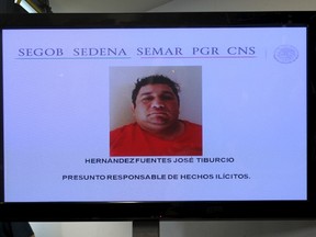 A screen showing a photo of Jose Tiburcio Hernandez Fuentes is seen during a news conference by government security spokesman Alejandro Rubido (not pictured) at the interior ministry in Mexico City April 18, 2015. REUTERS/Bernardo Montoya