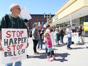 Participants take part in a rally against Bill C-51 in Sudbury, Ont. on Saturday April 18, 2015. A small crowd participated in the demonstration and march. Opponents of Bill C-51 fear the bill will encroach upon civil liberties. John Lappa/Sudbury Star/Postmedia Network