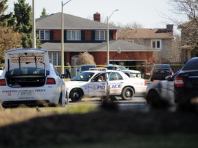 Kingston Police cruisers surround a residence on Briarwood Drive in Kingston on Saturday.(Joseph Steven/Special to the Kingston Whig-Standard/Postmedia Network)