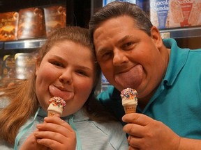 Byron Schlenker, right, and daughter Emily have the world's widest tongues, says the Guinness Book of World Records. (Byron Schlenker/Facebook photo)