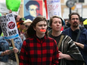Protesters march down Wellington Street, Saturday afternoon, April 18, 2015. The demonstration was in protest to Bill C-51, the Conservatives' anti-terror legislation. 
Andrew Meade/Ottawa Sun/Postmedia Network