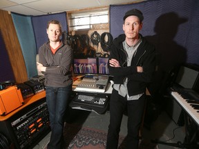 Will (left) and Andrew Grierson are lamenting the theft of musical instruments from their home in Winnipeg, Man. on Saturday, April 18, 2015.
