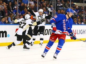 Pittsburgh Penguins' Sidney Crosby celebrates his second period goal with left wing Chris Kunitz during game 2 of the 2015 NHL Stanley Cup Playoffs Round 1 at Madison Square Garden. The Penguins defeated the Rangers 4-3. (Andy Marlin/USA TODAY Sports)