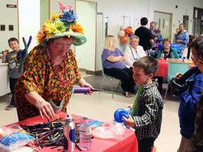 Chuckles the Clown faced a long line of event-goers looking for balloon animals, flowers and swords. (Steph Crosier, The Whig-Standard, Postmedia Network)