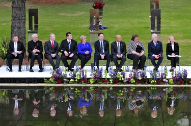 Former U.S. President Bill Clinton, along with city and state officials, is seen during the 20th Remembrance Ceremony, the anniversary ceremony for victims of the 1995 Oklahoma City bombing, at the Oklahoma City National Memorial and Museum in Oklahoma City April 19, 2015. REUTERS/Nick Oxford