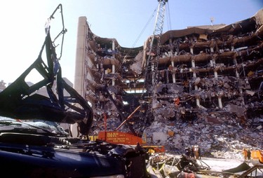 A damaged car sits across the street from the Alfred P. Murrah Federal Building after a 1200 pound truck bomb blew off the north side of the building in downtown Oklahoma City, in this file photo taken April 21, 1995.  Sunday marks the 20th anniversary of the bombing - the nation's worst act of domestic terrorism - that killed 168 people.  Anti-government militant Timothy McVeigh, who conceived and carried out the attack, was executed in 2001. His accomplice Terry Lynn Nichols is in prison for life.   REUTERS/Staff/Files