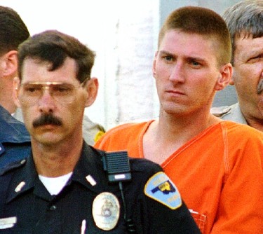 Timothy McVeigh (R) is escorted from the Noble County Courthouse by FBI agents and local police in Perry, Oklahoma, in this file photo taken April 21, 1995. Sunday marks the 20th anniversary of the bombing of the federal building in Oklahoma City - the nation's worst act of domestic terrorism - that killed 168 people.  McVeigh, who conceived and carried out the attack, was executed in 2001. His accomplice Terry Lynn Nichols is in prison for life.  REUTERS/Jim Bourg/Files